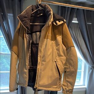 Marmot Women's Tan and Black Ski Jacket with detachable hood.